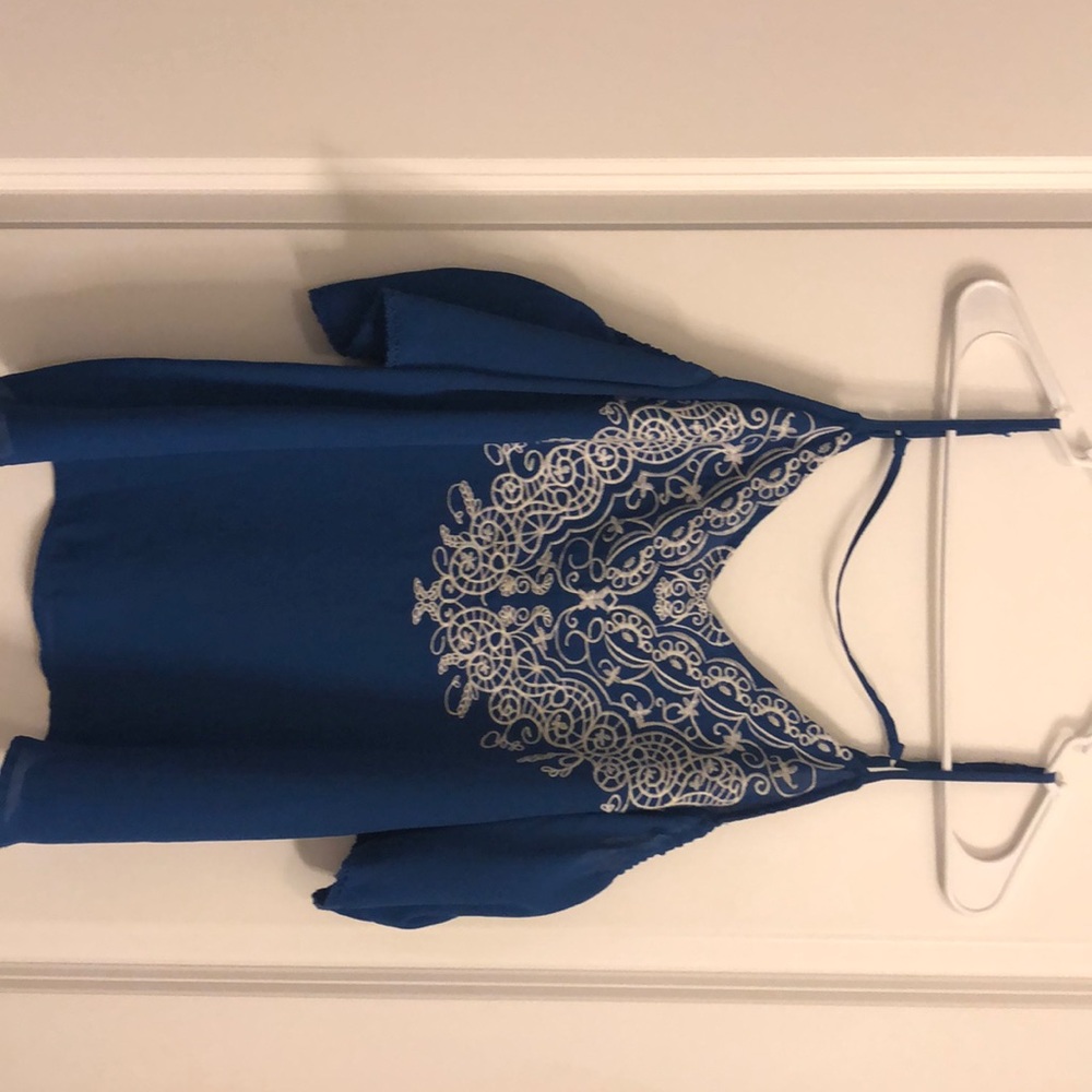 Blue top with white embroidery
